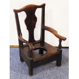 A rare 18th century child's mahogany commode chair;