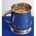 An early 20th century hallmarked silver christening tankard of circular section;