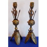 An interesting pair of 19th century military-style gilt-bronze candlesticks;