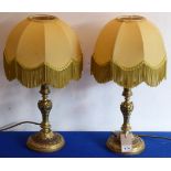 A pair of gilt-metal candlesticks in 19th century style (now as table lamps with shades)