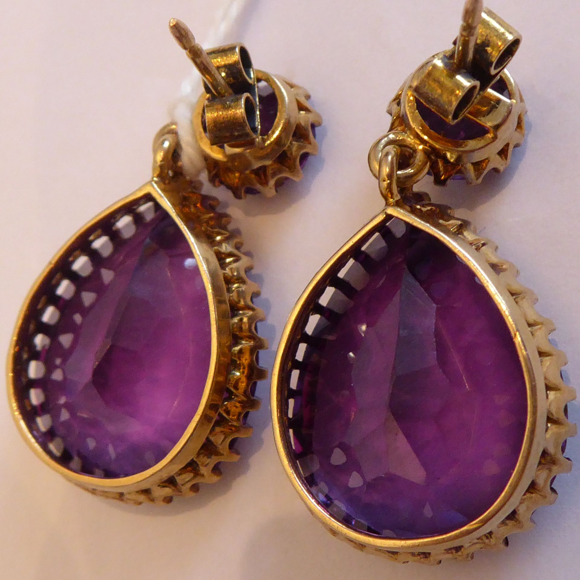 A pair of yellow metal drop earrings set with large pear-shaped hand-cut amethysts - Image 6 of 11