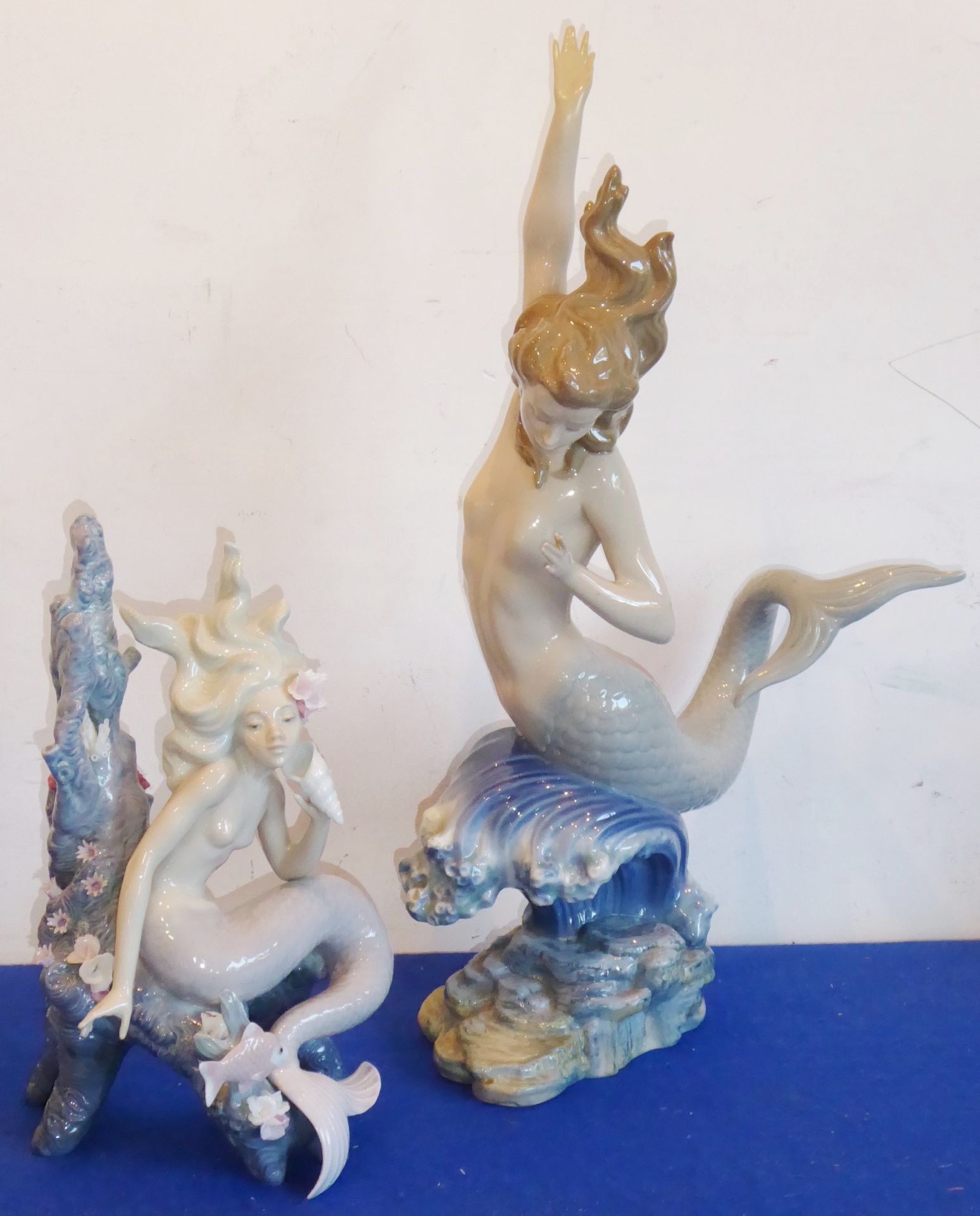 Lladro porcelain, 'Mermaid on a Wave' (No. 1347) together with 'Ocean Beauty' (No.