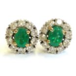 A pair of fine quality emerald and diamond cluster stud earrings