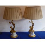 A highly decorative pair of French-style gilt-bronze table lamps and shades;