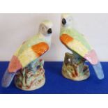 A opposing pair of 19th century Staffordshire-style models of parrots, 19.
