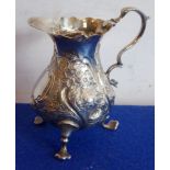 A mid-18th century hallmarked silver baluster-shaped cream jug;