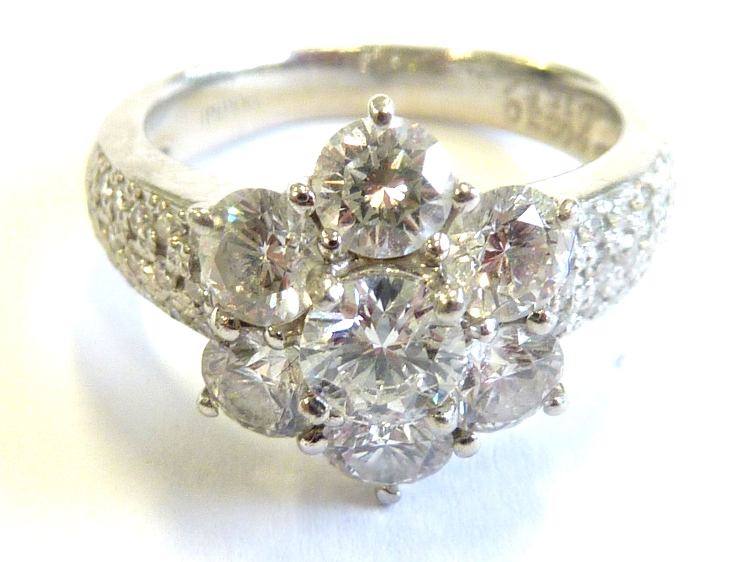 A superb platinum and diamond daisy cluster ring CONDITION REPORT: Although we are