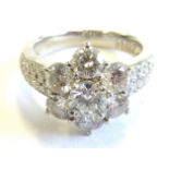 A superb platinum and diamond daisy cluster ring CONDITION REPORT: Although we are