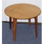 An early-20th century circular oak occasional table on four slightly splaying tapering legs by