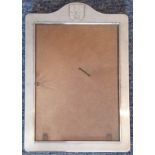 A modern hallmarked silver (marked 925) photograph frame with shield-shaped crest surmounting,