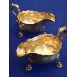 A pair of large hallmarked silver sauce boats in mid-18th century style;