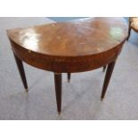 A 19th century Continental walnut and rosewood-crossbanded demi-lune card table raised on turned