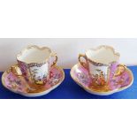 A pair of late-19th century Dresden-style two-handled porcelain chocolate cups on conforming