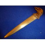 A heavy bronze letter opener; the terminal naturalistically fashioned as an open-mouthed eagle,