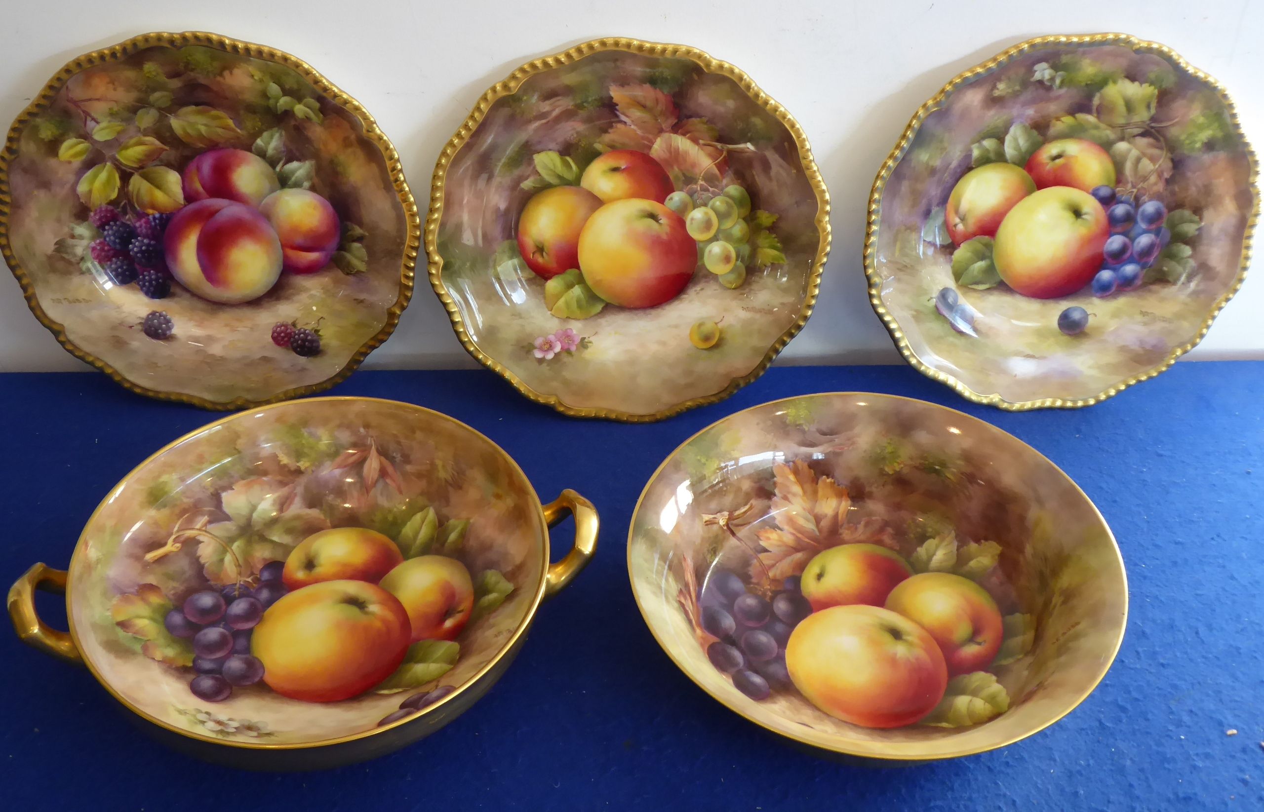 An English fine bone china part dessert service comprising three plates with shaped raised gilded