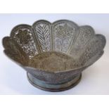 A fine Eastern (probably Persian) white metal flower-head-shaped filigree bowl;