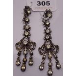 A showy pair of paste and metal pendant drop earrings (stone missing)