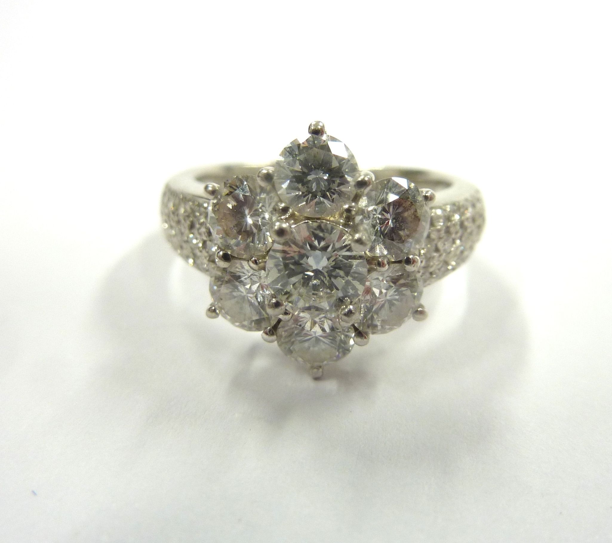 A superb platinum and diamond daisy cluster ring CONDITION REPORT: Although we are - Image 2 of 7