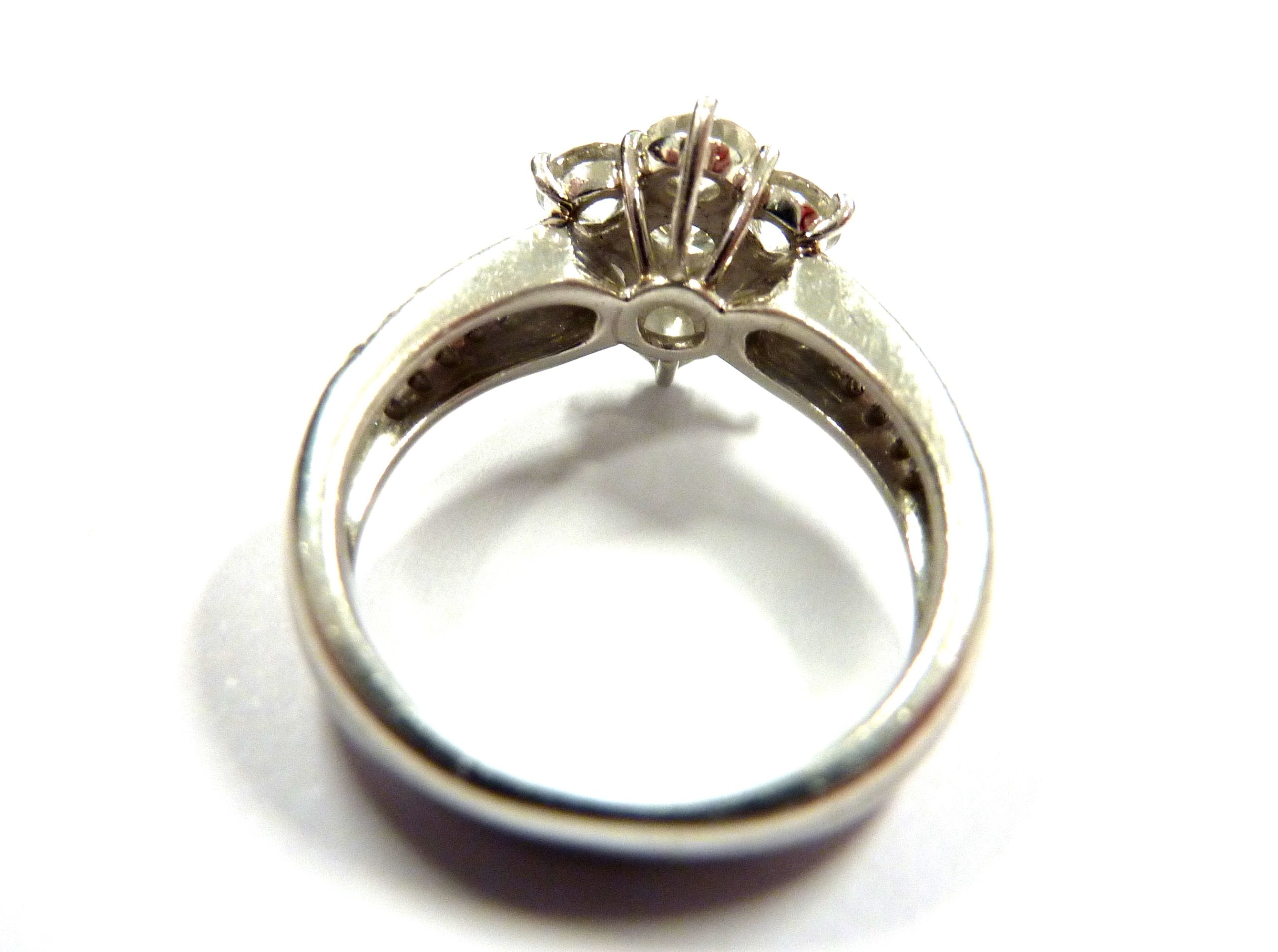 A superb platinum and diamond daisy cluster ring CONDITION REPORT: Although we are - Image 3 of 7