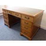 A George III style mahogany pedestal desk (20th century);