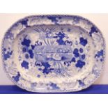 A large early-19th century ceramic meat platter transfer decorated in blue-and-white with a central