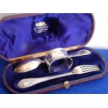 A 19th century cased spoon, fork and napkin ring; the spoon and fork assayed London 1870,