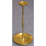 A large and heavy solid brass pricket stick with detachable circular drip-pan;