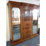 A large Edwardian mahogany and satinwood-crossbanded compactum;