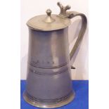 A large and heavy lidded Scottish pewter tankard of tapering cylindrical form;