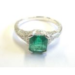 An 18-carat white gold and square-cut Columbian emerald ring