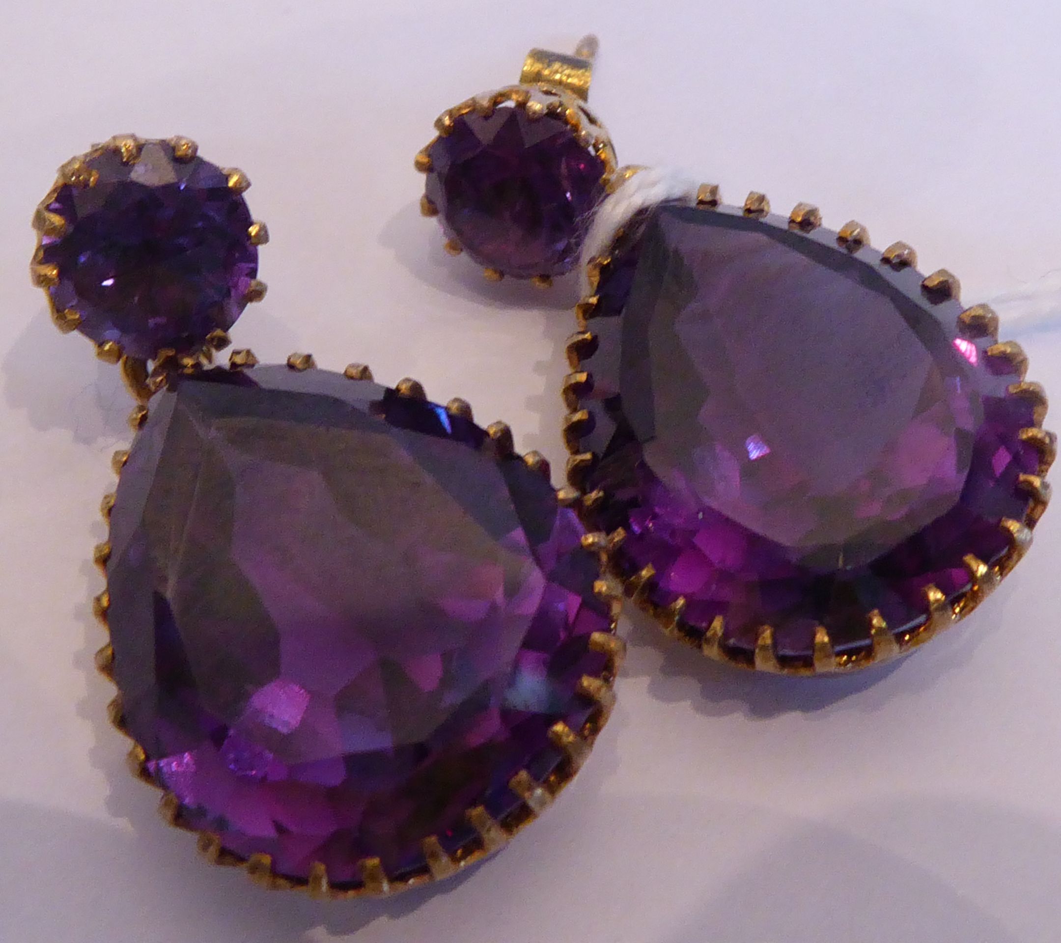 A pair of yellow metal drop earrings set with large pear-shaped hand-cut amethysts - Image 9 of 11