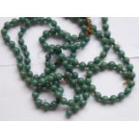 A single-row uniform Nephrite 134-bead necklace