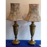 A pair of tall baluster-shaped brass table lamps;