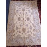 A cream ground handmade Chobi rug (1.90 x 1.30)