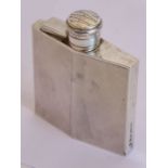 An Art Deco period hallmarked silver spirit flask of lozenge shape; the hinged fixed circular top