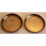 A pair of mid-20th century hallmarked-silver circular dishes; each engraved with the Death or