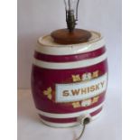 A 19th century ceramic whisky barrel (now as a lamp), the barrel 33cm high