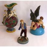 Various 19th century pottery for restoration to include a Minton Majolica ewer adorned with cherubs,