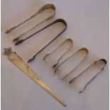 A varied assortment of five hallmarked silver sugar tongs (including some Georgian examples),