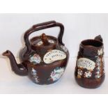 A 19th century Barge ware pottery teapot with applied plaque 'A Present From A Friend' together with