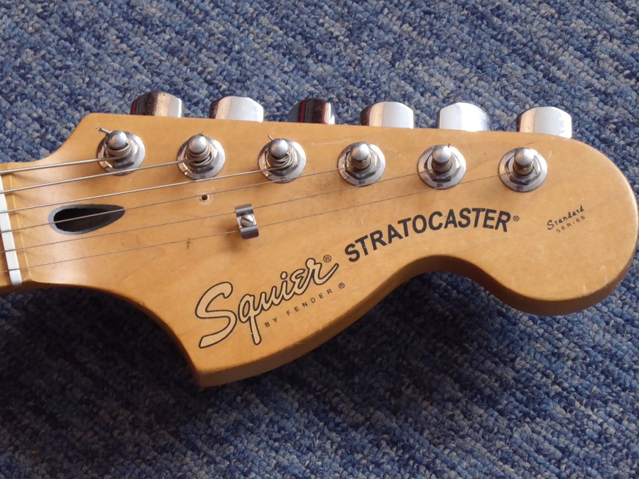 A Squier Stratocaster (by Fender) six-string 20th anniversary issue electric guitar in sunburst, - Image 2 of 5