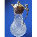 A large crystal and silver-plated claret jug