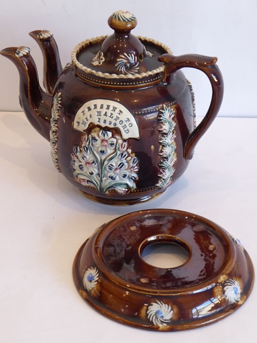 An unusual late-19th century twin-spouted Barge ware teapot with the applied plaque 'A Present to