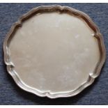 A white-metal serving tray with a reeded flower head-shaped edge, the underside marked HERIN. BLEYER