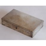 An early-20th century white-metal rectangular lockable box, cedarwood interior and the hinged lid