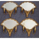 A set of four late-19th/early-20th century two-branch girandole, each with gilded fan-shaped frame