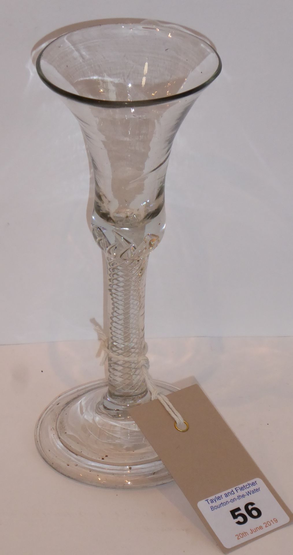 An 18th century style wine glass having a double spiral-twist stem and raised on circular folded - Image 2 of 2