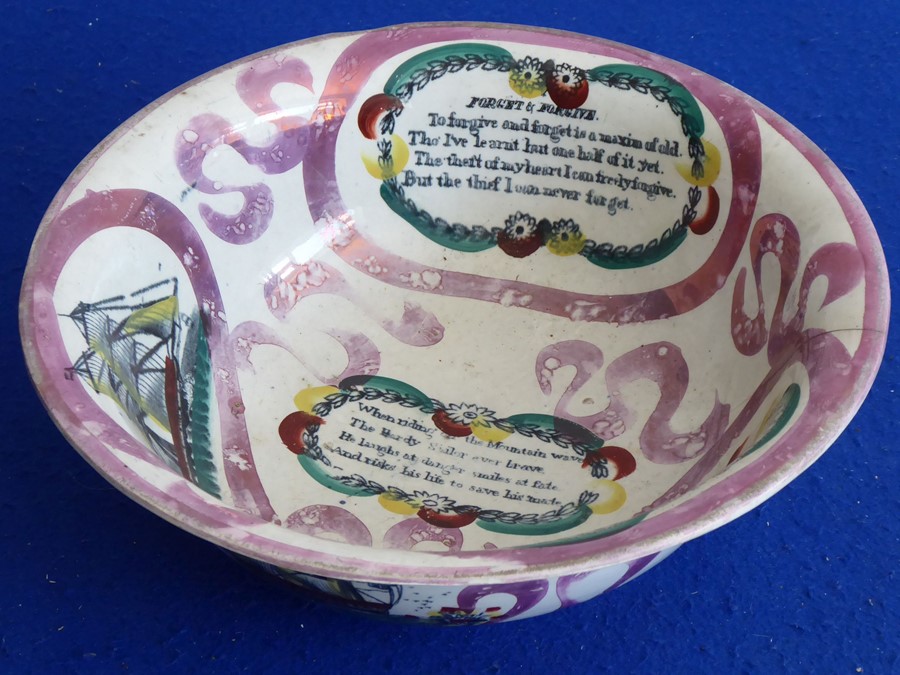 A mid-19th century Sunderland lustre pottery bowl typically decorated with mottoes and maxims and