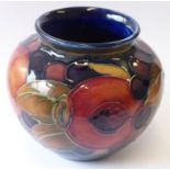 ADDED LOT    A small early 20th Century Moorcroft Pottery ovoid shaped vase decorated in the