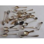 A varied selection of hallmarked silver tea spoons, sugar tongs and salt spoons etc., together